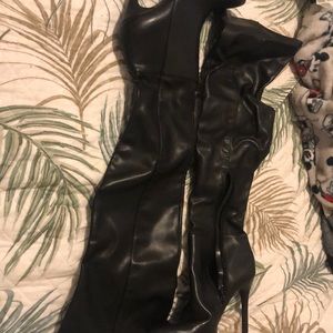 Knee length high heeled boots